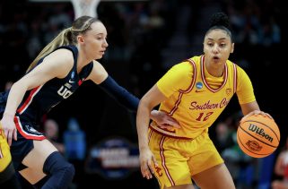 Juju Watkins blocks Paige Bueckers and lays it up on the other end, extending USC's lead vs. UConn